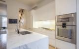 brownstone, contemporary, light, white, fireplace, kitchen, deck, 